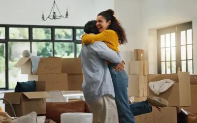 couple embracing while moving into new home
