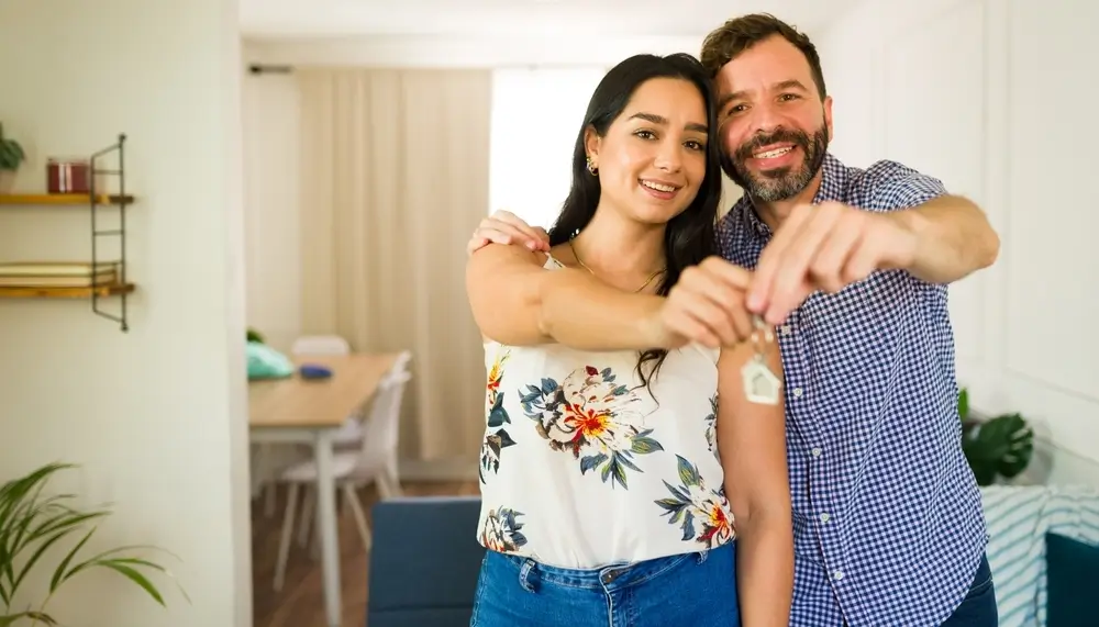 Couple getting handed new home key